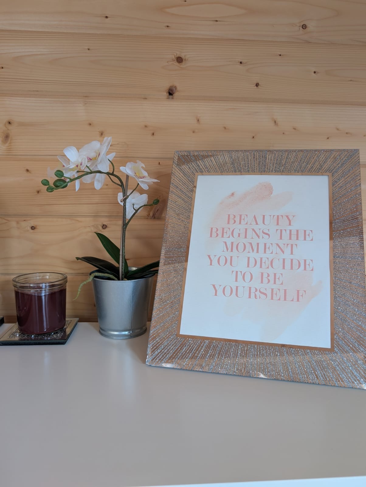 'Beauty begins the moment you decide to be yourself' framed sign